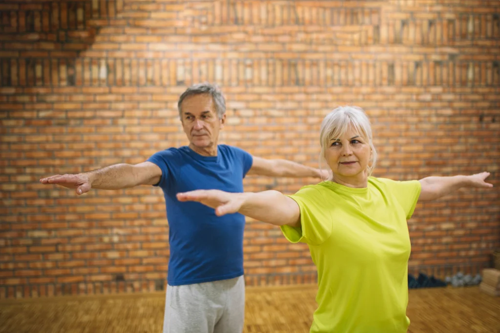 Elderly people doing balance exercise