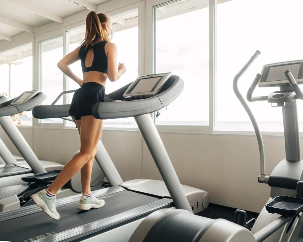 women doing exercise in hotel gym