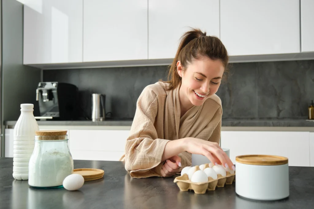 women preparing protein based foods with eggs