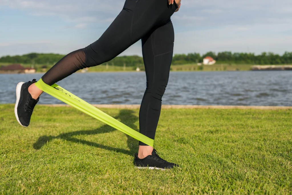 women using resistance band in legs