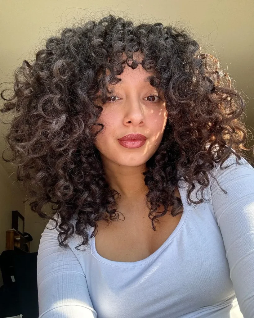 Thick Curly Hair With Curtain Bangs